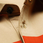 Polo en piqué de coton avec broderie joueur rayé